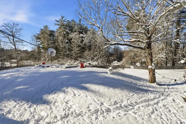 a view of yard covered with snow