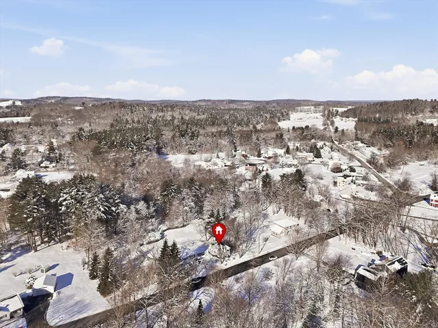 an aerial view of city and mountain