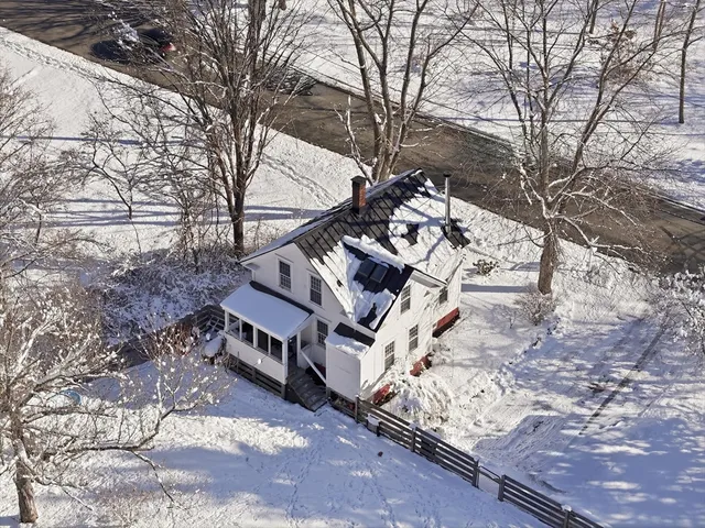 a view of a house with snow on the side