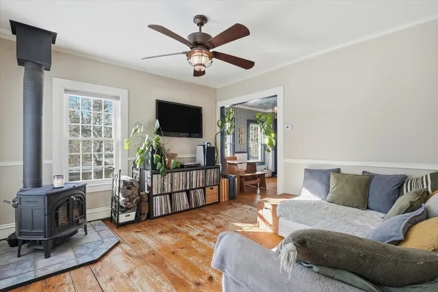 a bedroom with furniture and a flat screen tv