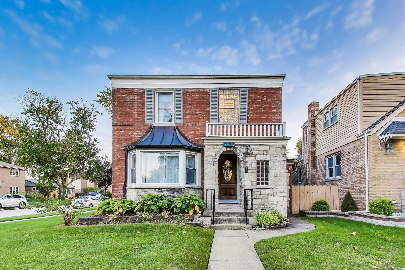 7401 West Main Street Niles, IL 60714 - Photo 1 of 37 front view of a house with a yard