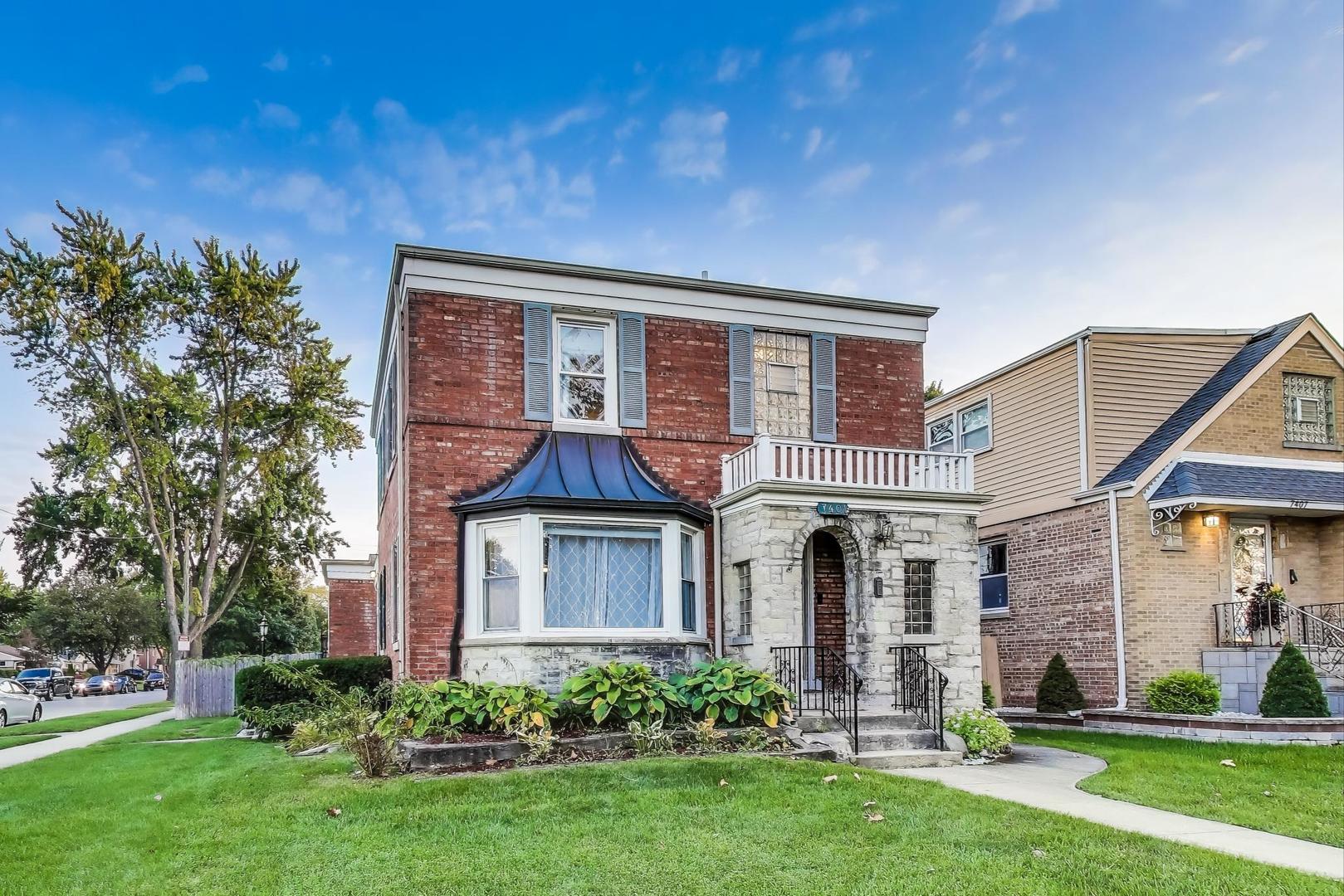 7401 West Main Street Niles, IL 60714 - Photo 3 of 37 a front view of a house with a yard