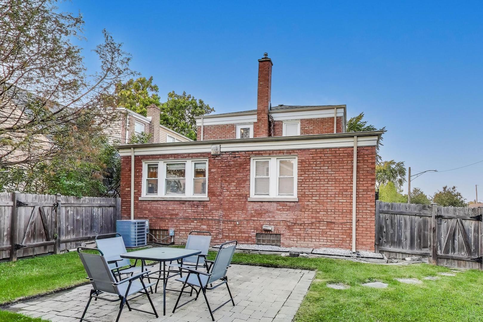 7401 West Main Street Niles, IL 60714 - Photo 32 of 37 a front view of a house with garden