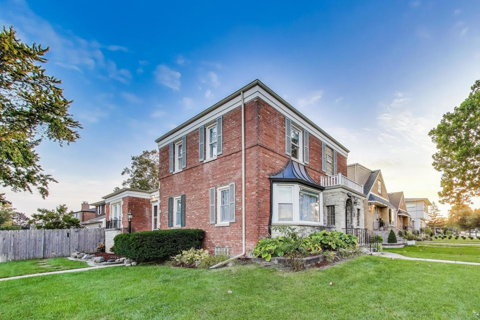 7401 West Main Street Niles, IL 60714 - Photo 4 of 37 a front view of a house with a yard