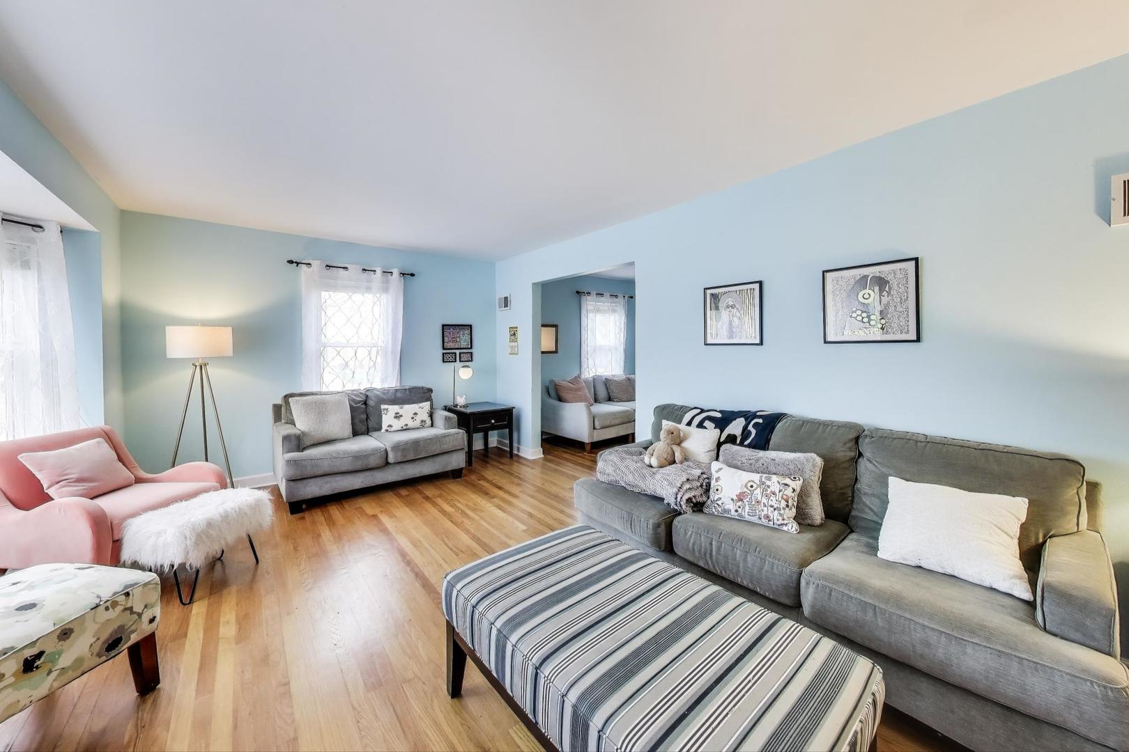 7401 West Main Street Niles, IL 60714 - Photo 5 of 37 a living room with furniture and wooden floor