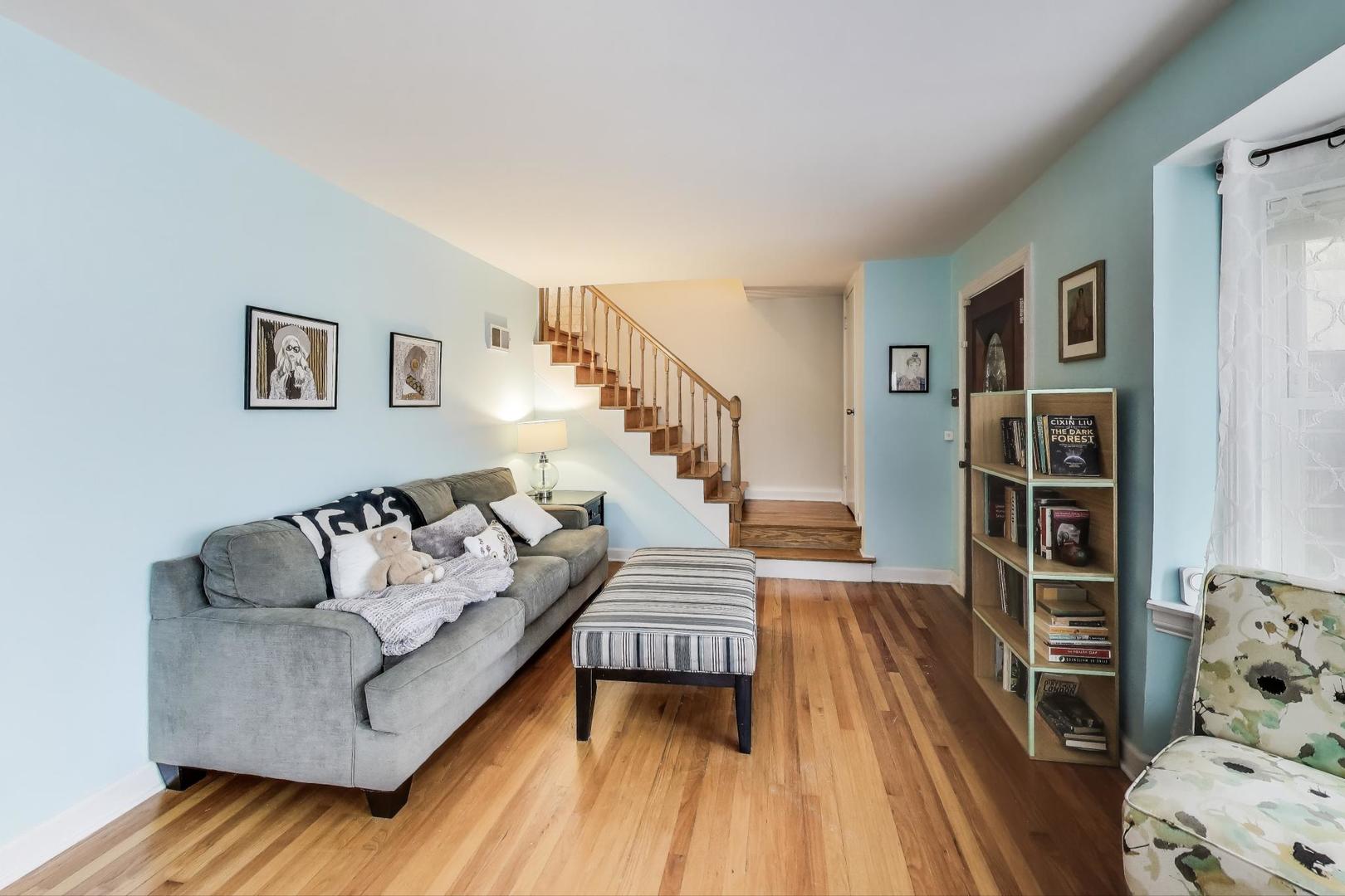 7401 West Main Street Niles, IL 60714 - Photo 7 of 37 a living room with furniture and stairs
