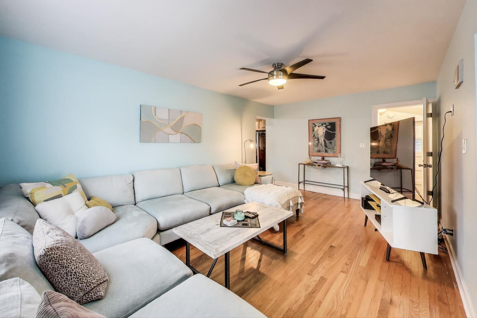7401 West Main Street Niles, IL 60714 - Photo 9 of 37 a living room with furniture and a flat screen tv