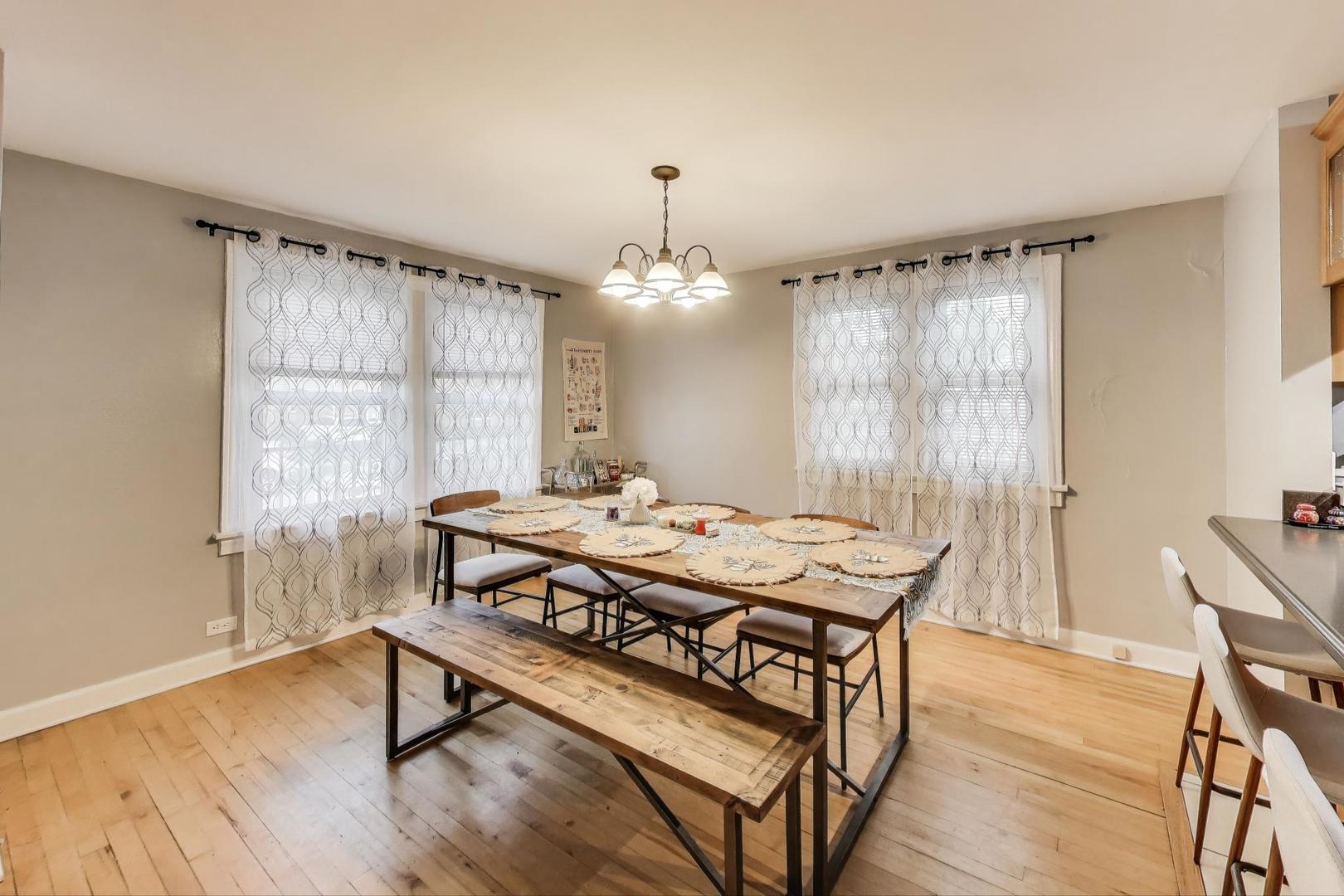 7401 West Main Street Niles, IL 60714 - Photo 10 of 37 a dining room with a table and chairs