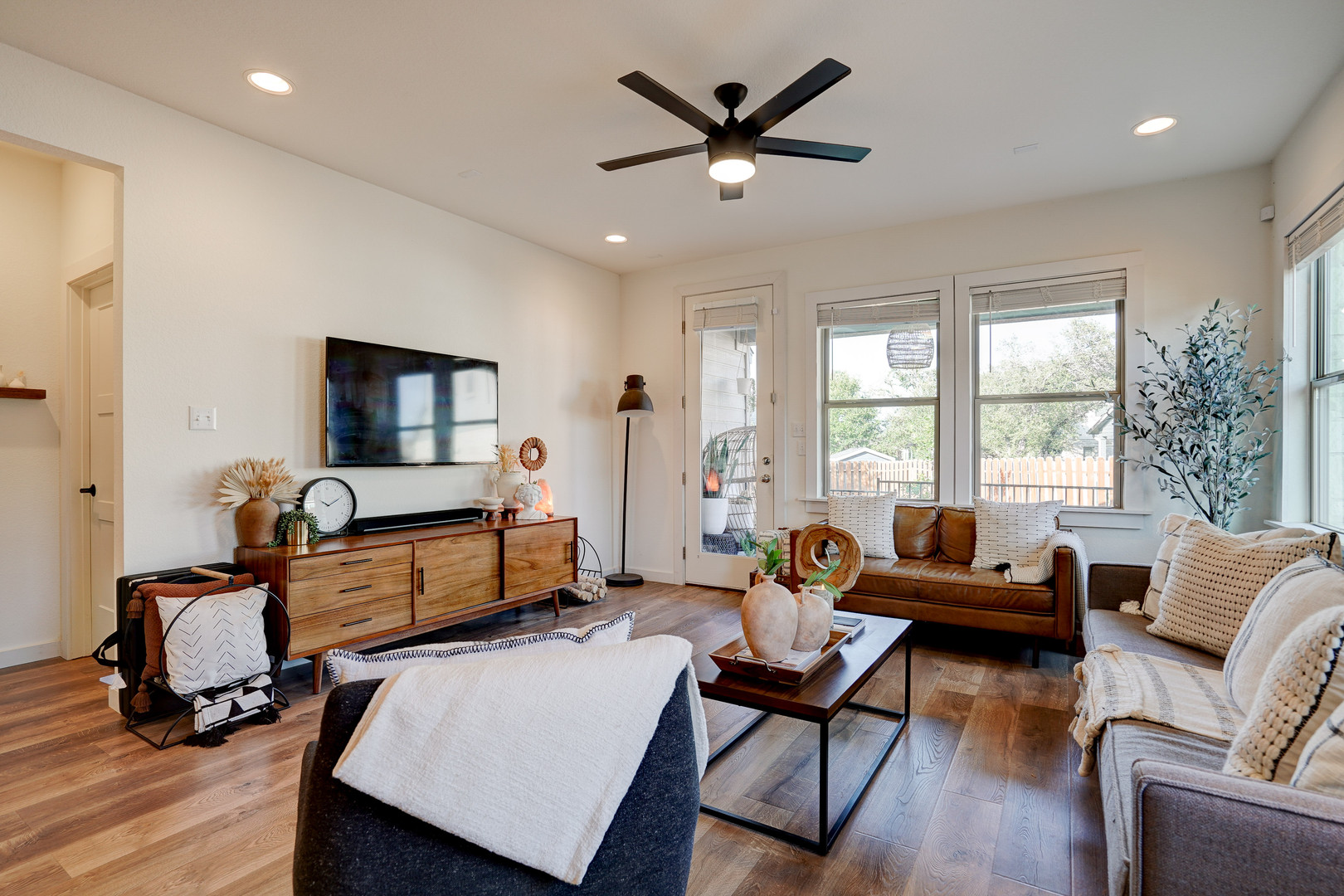 2240 Ringstaff Road Leander, TX 78641 - Photo 12 of 25 Open-concept living space featuring wood-finish flooring, recessed lighting, and a modern ceiling fan
