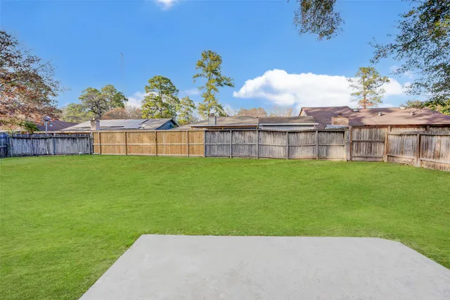 a view of a house with a back yard