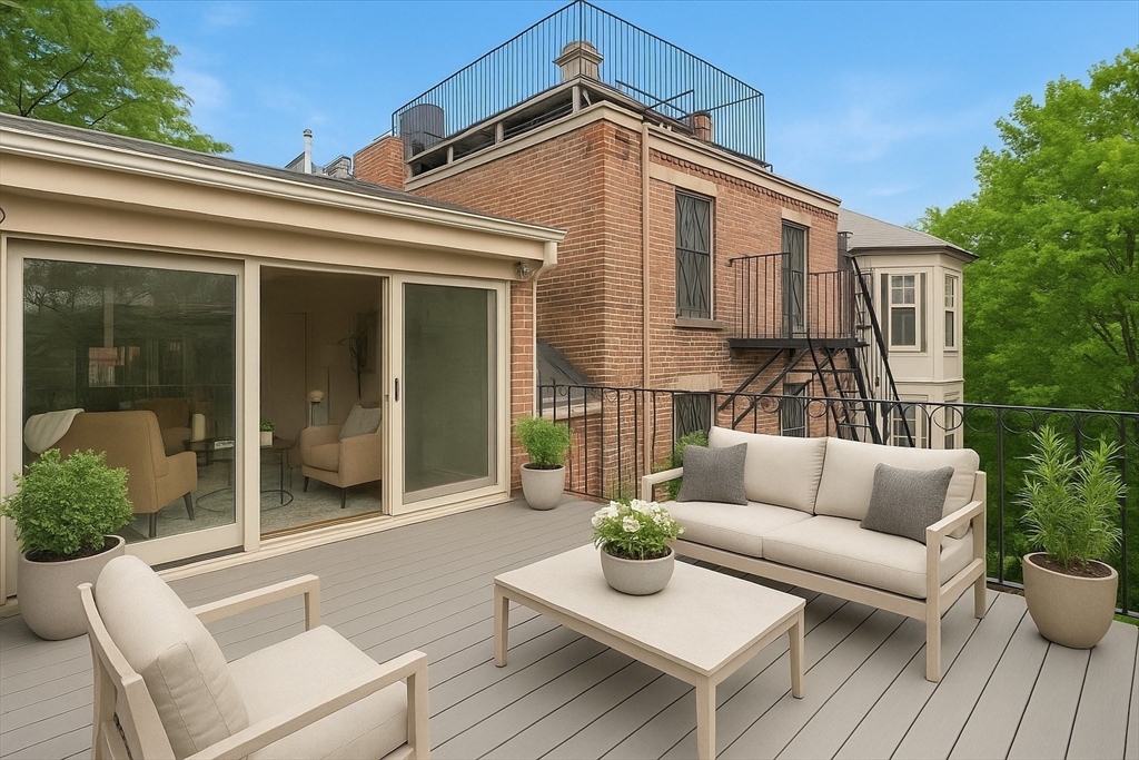 a view of house with couches and potted plants