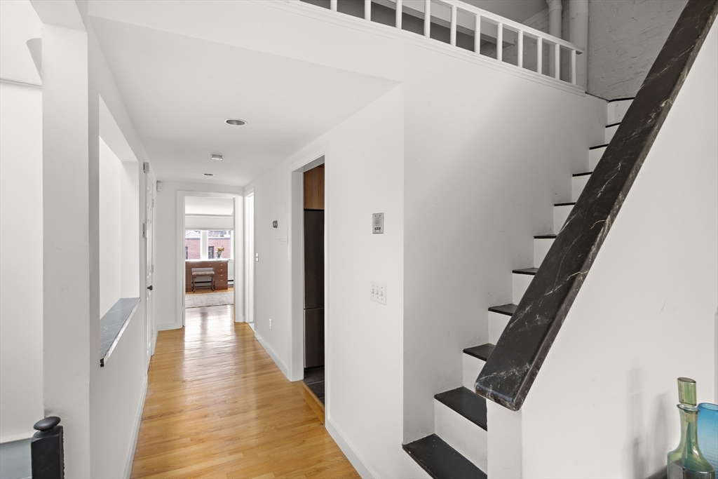 116 West Concord Street, Unit PH Boston, MA 02118 - Photo 11 of 16 a view of a hallway with wooden floor and entryway