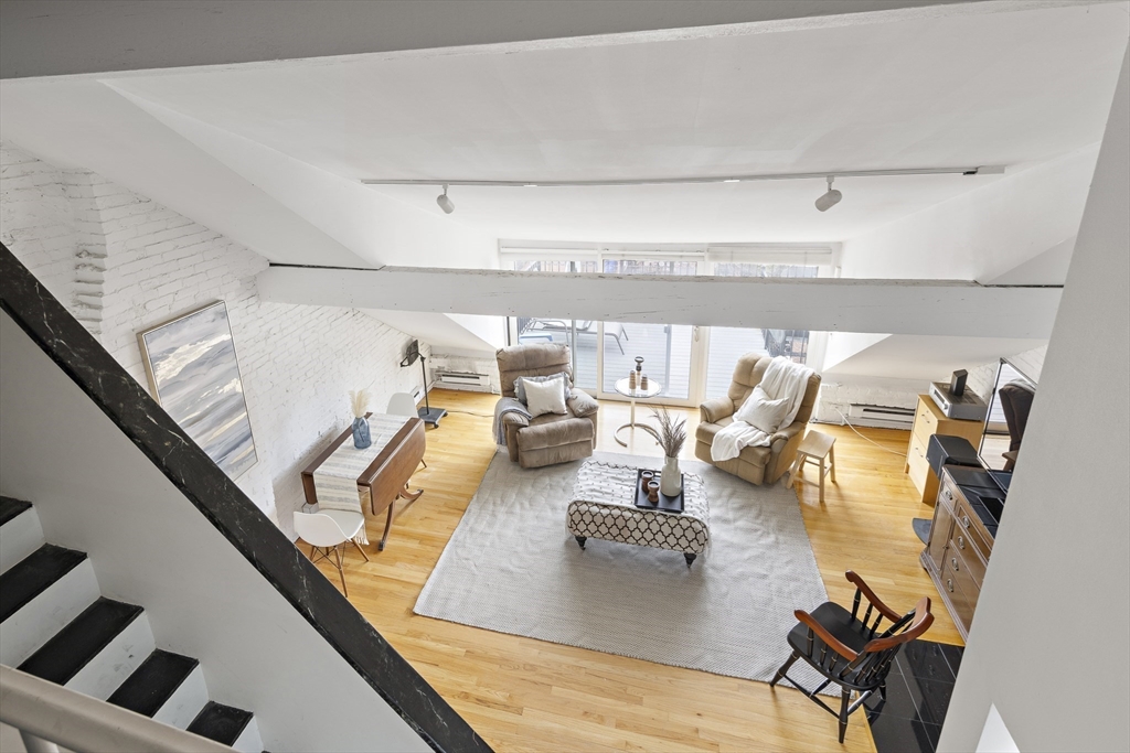 116 West Concord Street, Unit PH Boston, MA 02118 - Photo 12 of 16 a view of living room with furniture and floor to ceiling window