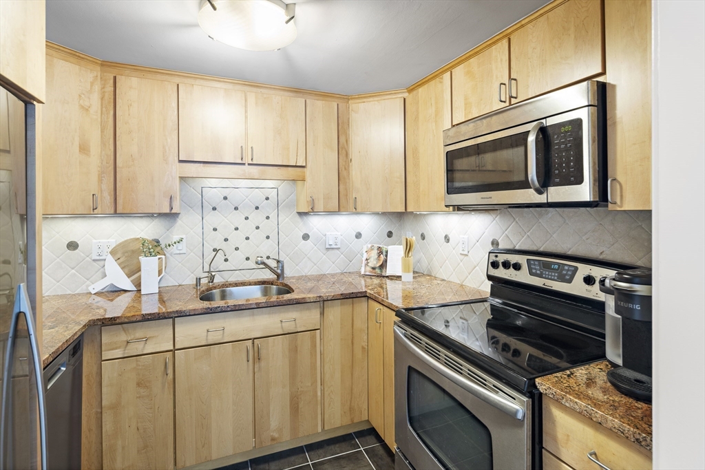 116 West Concord Street, Unit PH Boston, MA 02118 - Photo 13 of 16 a kitchen with appliances a sink and cabinets
