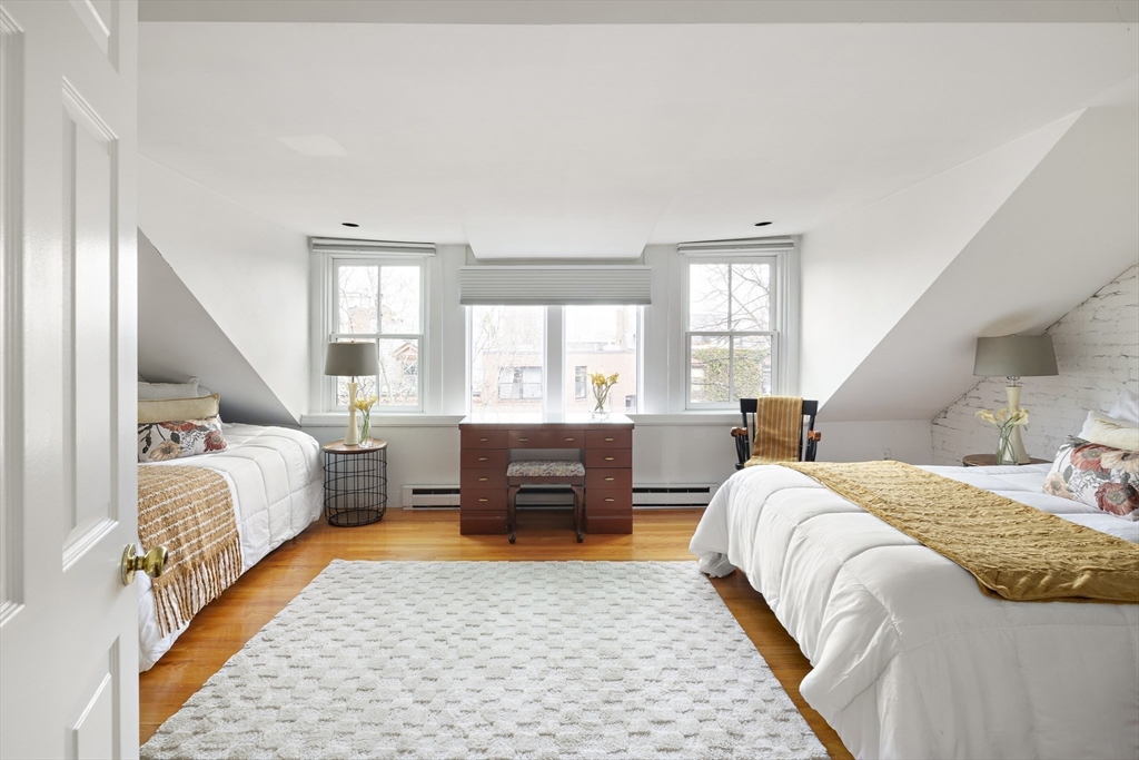 116 West Concord Street, Unit PH Boston, MA 02118 - Photo 15 of 16 a bedroom with a bed and wooden floor