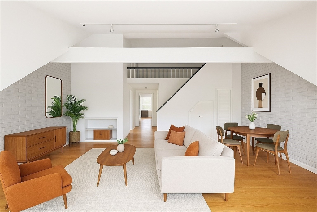 116 West Concord Street, Unit PH Boston, MA 02118 - Photo 3 of 16 a living room with furniture wooden floor and dining room