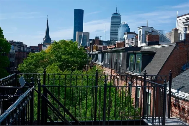 a view of a balcony with city view