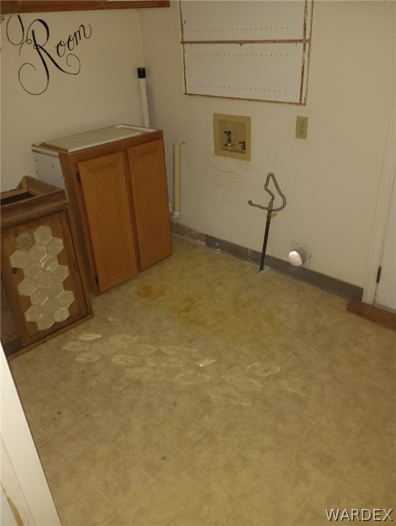 1083 Baseline Road Bullhead City, AZ 86442 - Photo 13 of 13 Laundry area with hookup for a washing machine and light tile flooring