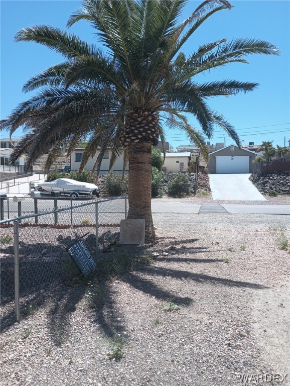 1083 Baseline Road Bullhead City, AZ 86442 - Photo 7 of 13 View of yard with a garage and an outdoor structure