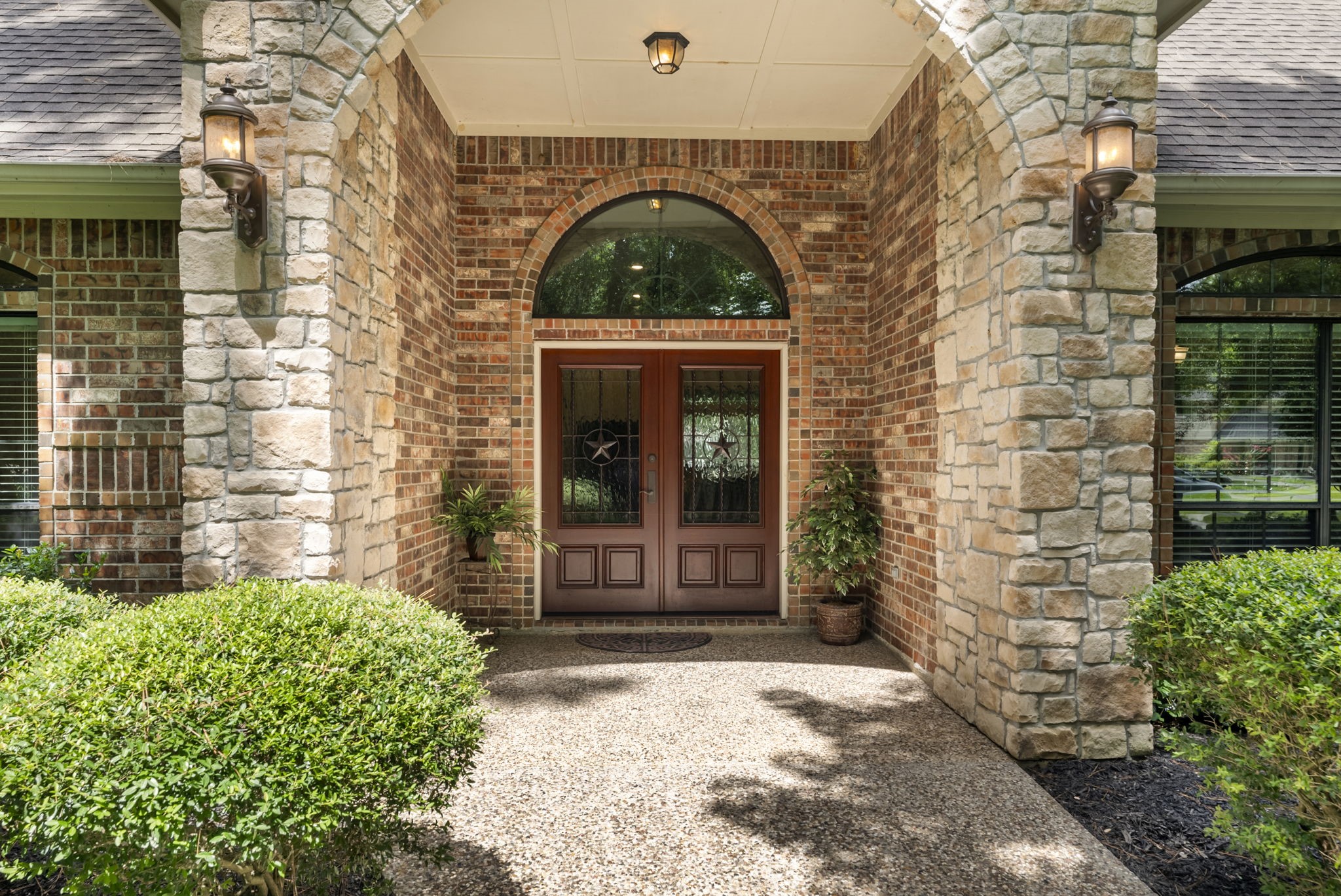 24311 Standing Oak Drive Spring, TX 77389 - Photo 5 of 42 a front view of a house with a garden