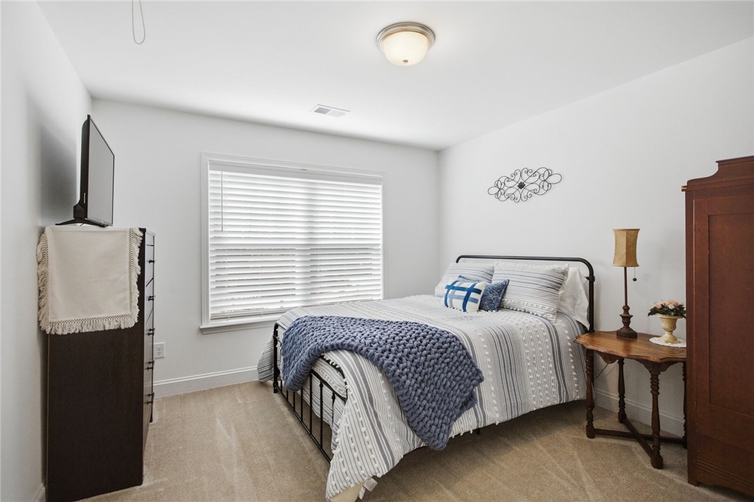 525 16th Circle Walhalla, SC 29691 - Photo 25 of 50 This cozy bedroom features soft carpet flooring and a well-lit space, offering comfort and tranquility.