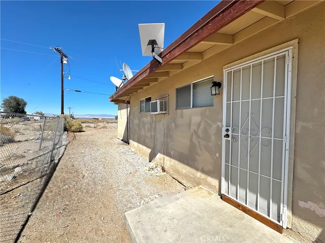 a view of a house with a snow in the background