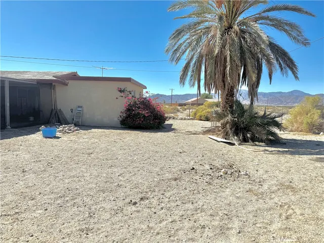 a view of a backyard of a house