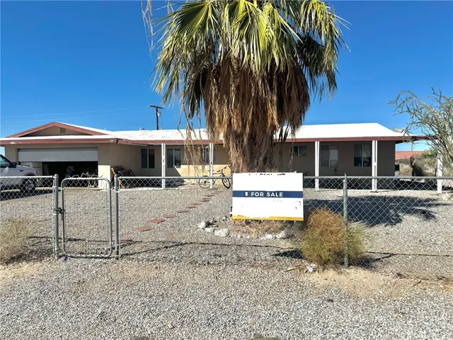a front view of a building with garden