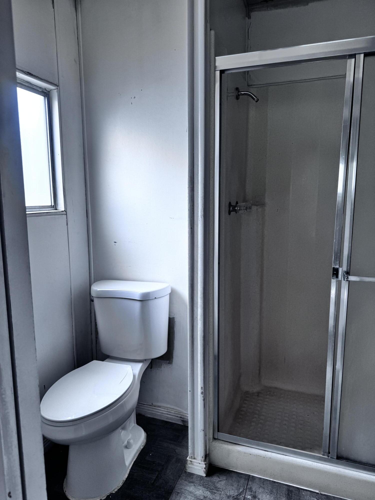 3 Foothill Road Lucerne Valley, CA 92356 - Photo 13 of 14 a white toilet sitting next to a shower