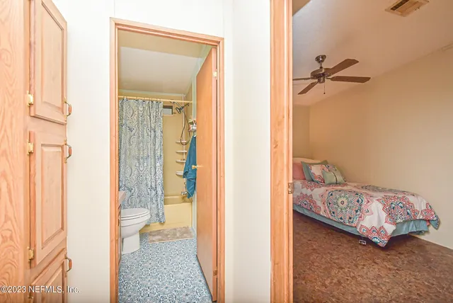 a bedroom with a bed and cabinets