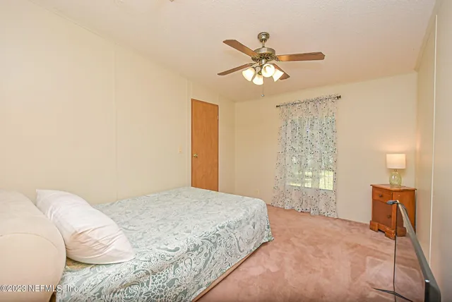 a bathroom with a sink mirror vanity and toilet