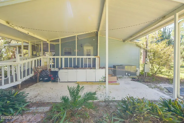 a view of a chairs and table in a patio