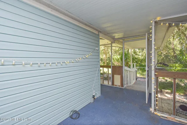 a view of a swimming pool with an outdoor space and seating area