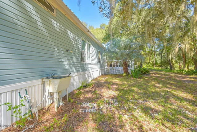 a view of a city with lush green forest