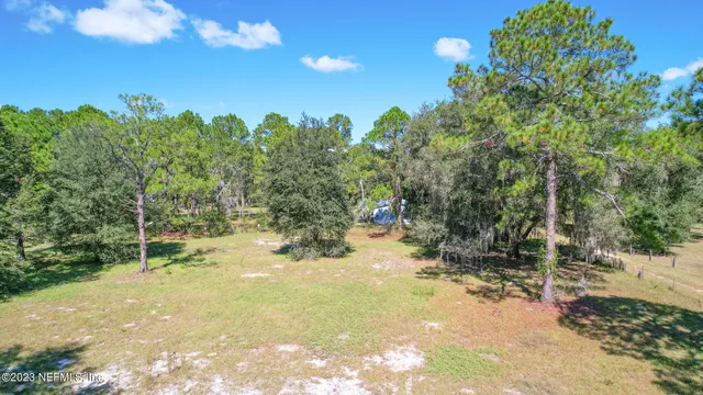 a view of swimming pool with a yard