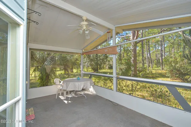 a living room with large windows