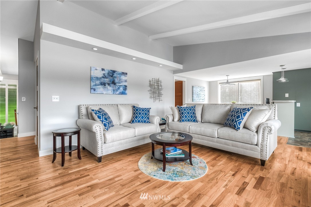 6417 Ripley Ln S East Renton, WA 98056 - Photo 20 of 39 a living room with furniture or couch and a wooden floor