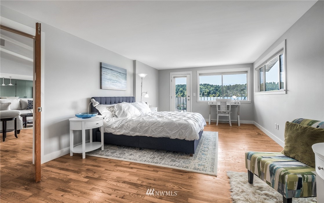 6417 Ripley Ln S East Renton, WA 98056 - Photo 21 of 39 a bedroom with a bed wooden floor and windows