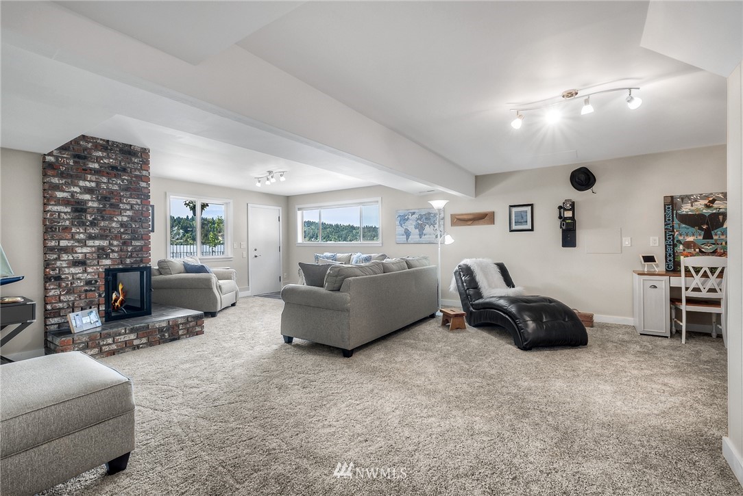 6417 Ripley Ln S East Renton, WA 98056 - Photo 23 of 39 a living room with furniture and a fireplace