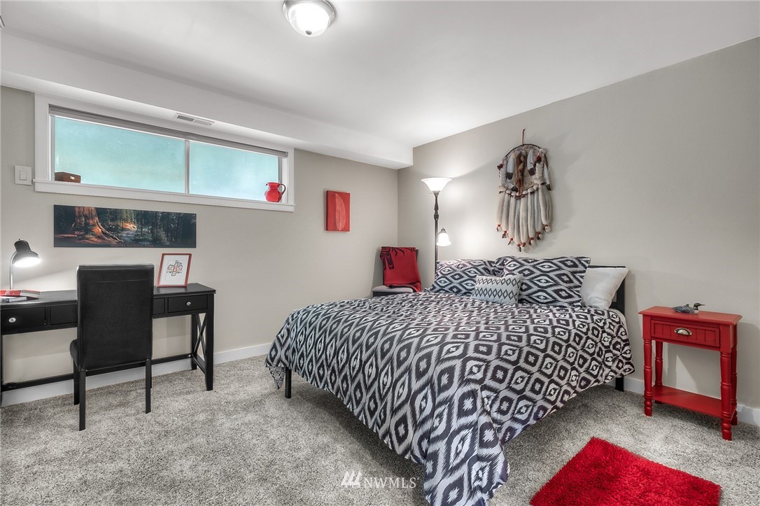 6417 Ripley Ln S East Renton, WA 98056 - Photo 25 of 39 a bedroom with bed and a desk