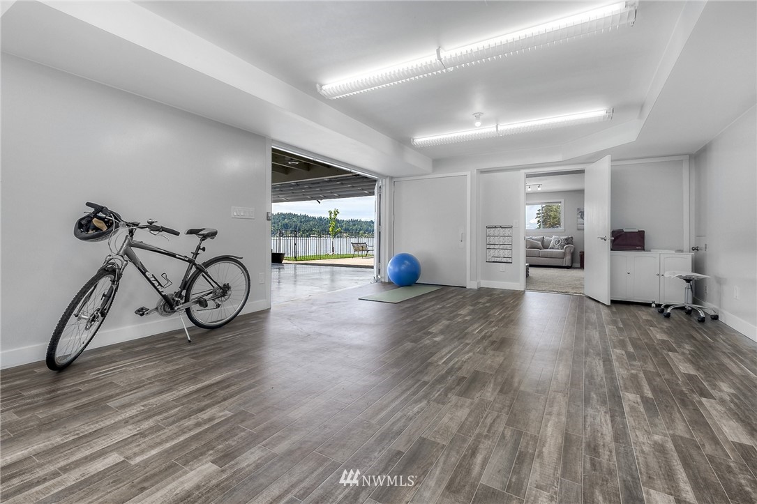 6417 Ripley Ln S East Renton, WA 98056 - Photo 29 of 39 a view of a room with gym equipment and wooden floor