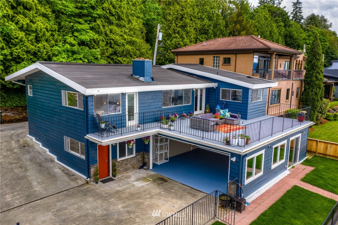 6417 Ripley Ln S East Renton, WA 98056 - Photo 36 of 39 a front view of a house with balcony yard and deck