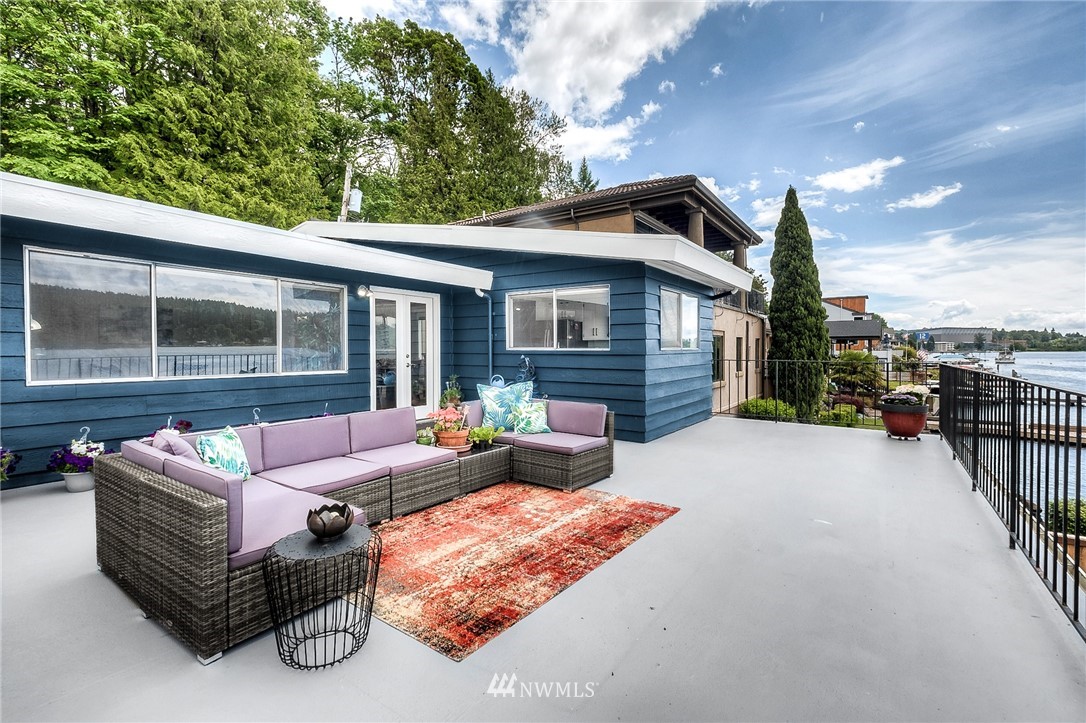 6417 Ripley Ln S East Renton, WA 98056 - Photo 7 of 39 a view of a patio with couches and a table and chairs with wooden fence