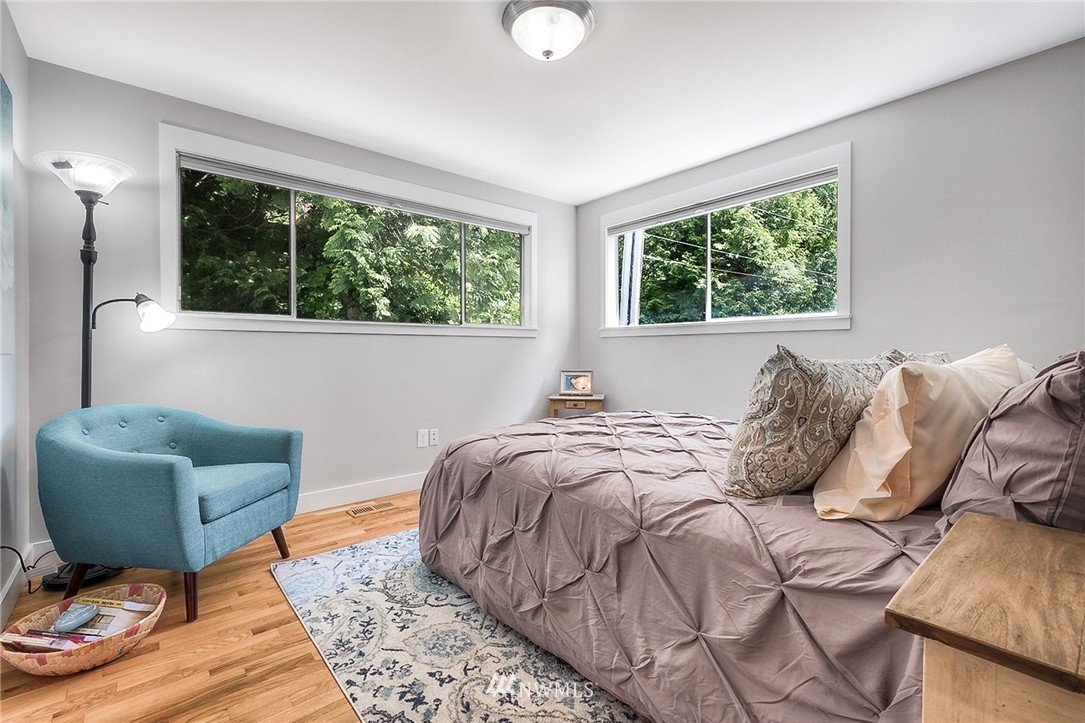 6417 Ripley Ln S East Renton, WA 98056 - Photo 9 of 39 a bedroom with a bed a couch and a window