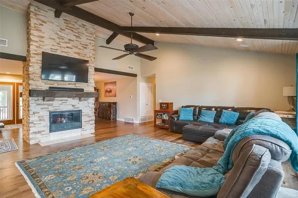 a living room with furniture and a fireplace