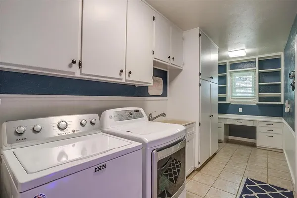a utility room with washer and dryer