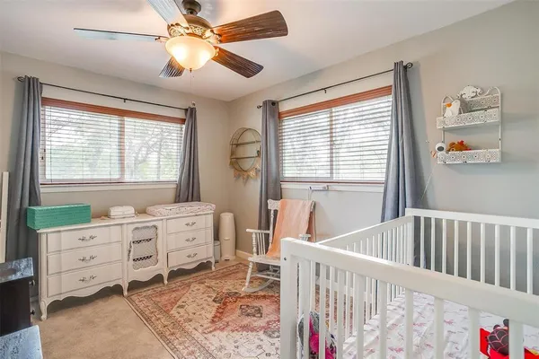 a bedroom with furniture and windows