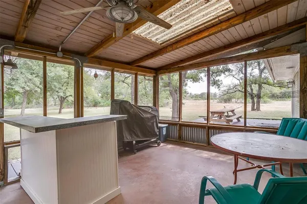 a view of a dining room with furniture window and outside view