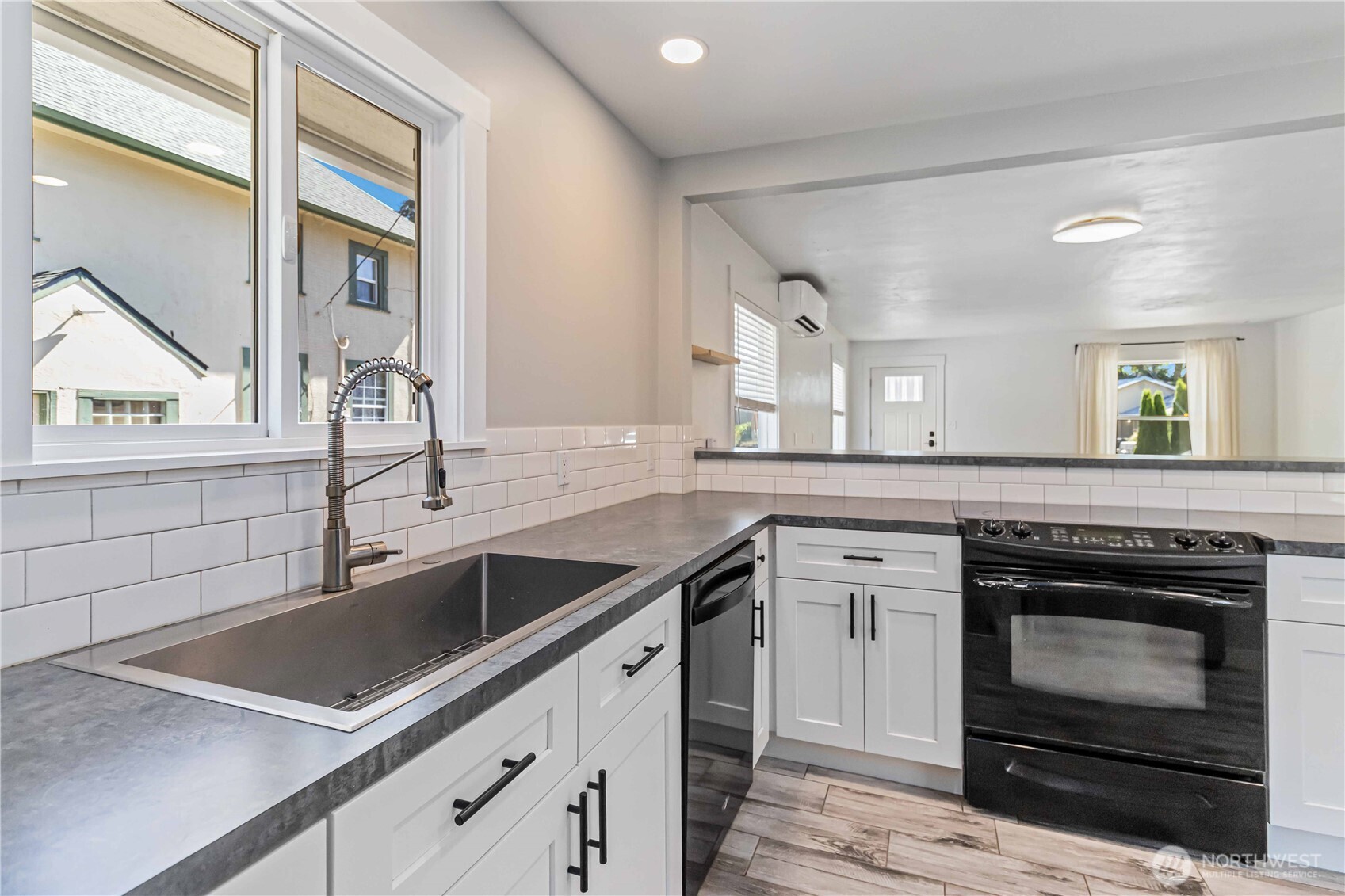 753 Southeast Sumner Street Camas, WA 98607 - Photo 14 of 37 a kitchen with a sink stove and microwave
