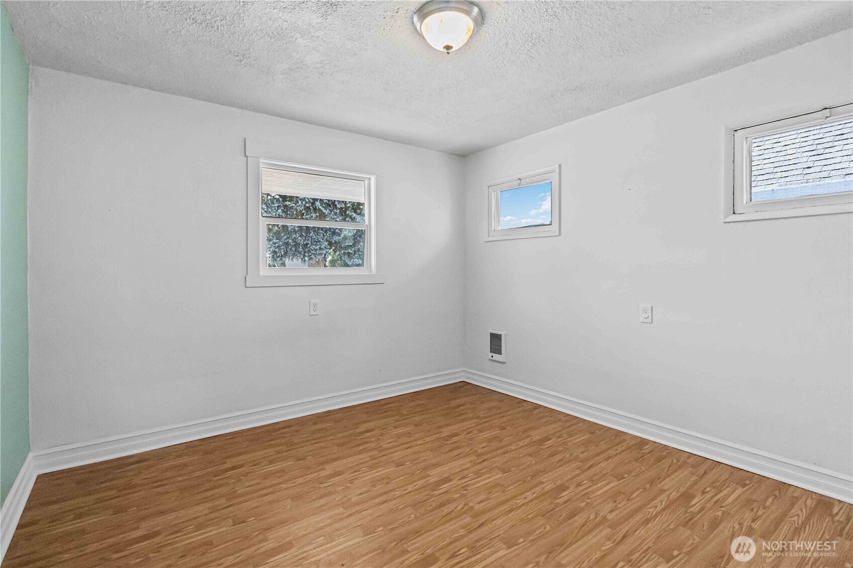 753 Southeast Sumner Street Camas, WA 98607 - Photo 18 of 37 a view of empty room with wooden floor